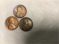 Three Lincoln wheat pennies