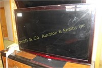 SAMSUNG FLAT SCREEN TV ON STAND