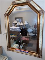 Large framed beveled glass wall mirror.