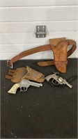 Vintage Cap guns both have damage Cast iron