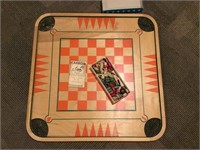 Carom board and playing pieces