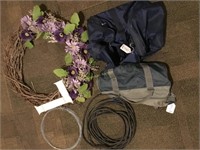 duffle bags, extension cord, cable, wreath