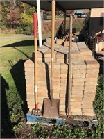 Square shovel cement hoe and a tater digger yard