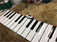 Battery operated floor mat piano