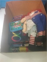 Box of games and Raggedy Ann and Andy