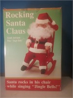 New in box rocking Santa Claus plays Jingle Bells