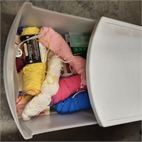 Plastic storage drawer with yarn