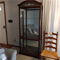 Tall lighted Curio Cabinet.