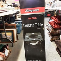 Snap on tailgate folding table