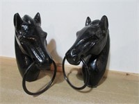 Two cast iron horse heads