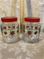 2 GLASS CANISTERS WITH POINSETTIA PATTERN