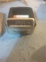Silver Zippo lighter in Zippo metal box
