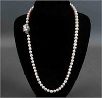 MATINEE LENGTH PEARL NECKLACE WITH DIAMOND CLASP