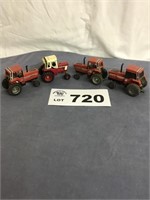 Four 1/64 Case and International Tractors