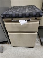 File Cabinet w/ removable padded top. Rolls