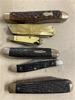 Six pocket knives in used condition the bottom