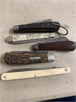 Five pocket knives the bottom one is 6 inches