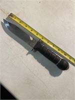 Military style knife with compass in the handle.
