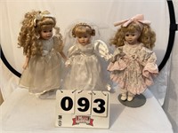 3 Porcelain collectors dolls with stands.