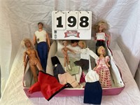 Vintage Barbie dolls and one Ken doll with some