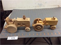 2 hand-crafted wooden tractors