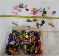 collection of small toys in bin