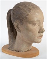 SCULPTURE OF GIRL WITH PONYTAIL