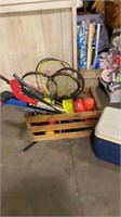 Crate of sports items and cooler