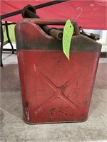 Large red metal gas can