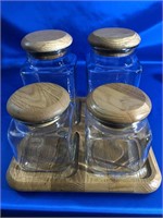 4 PIECE GLASS CANISTER SET WITH WOOD LIDS ON L