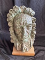 Ceramic bust on wooden stand