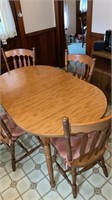SkHardwood table with four chairs leaf