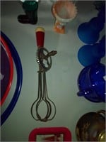 old red handle hand mixer