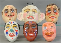 FIVE EARLY PAINTED HALLOWEEN MASKS & A YELLOW KID