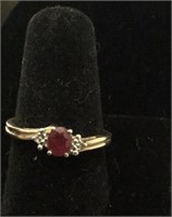 10k YG  1.50 Ruby with 2 side Diamond accents,