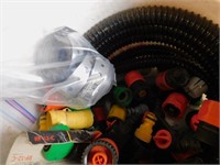 Bucket of PVC & garden hose supplies