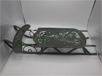 Green metal decorative cut-out sled w/evergreen
