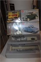 4 VEHICLE MODELS IN BOXES