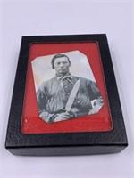 small antique photograph in a small shadow box ove
