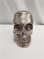 Aluminum skull, makes a very nice desktop decorati