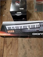 m-Audio electric keyboard in box, and a box of ass