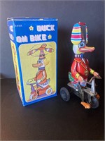 Vintage Wind Up Tin Duck On Bike Toy