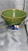 Early green stoneware bowl has some chips