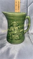Old green pottery pitcher