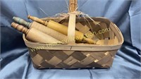 3 old rolling pins in basket