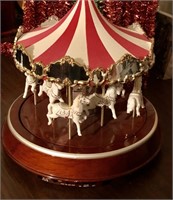 Carousel that lights up- approx 12" wide.