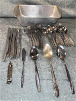 (B) Stainless Steal silverware and bread pan.