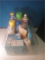 Plastic tub of cleaning supplies