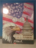 Empty Washington quarters collector book