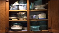Three shelves of plastic storage, paper plates,